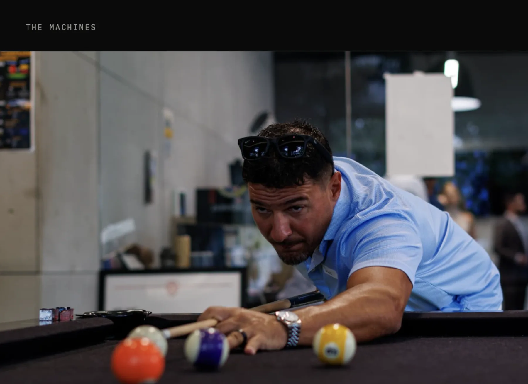 Dario Diaz lining up a shot at the lounge pool table