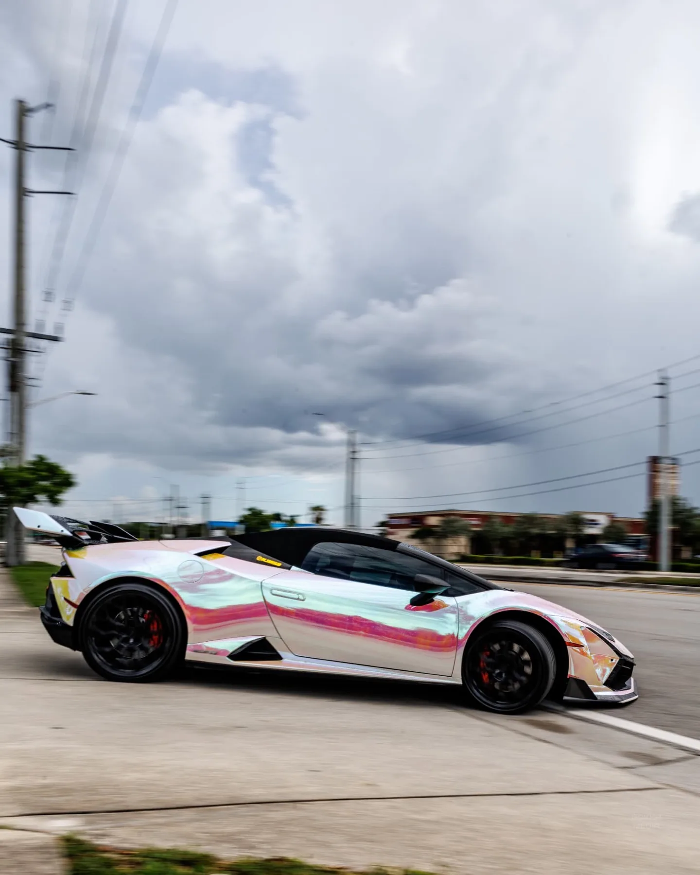 Iridescent wrapped Lamborghini Huracan in a rolling side profile