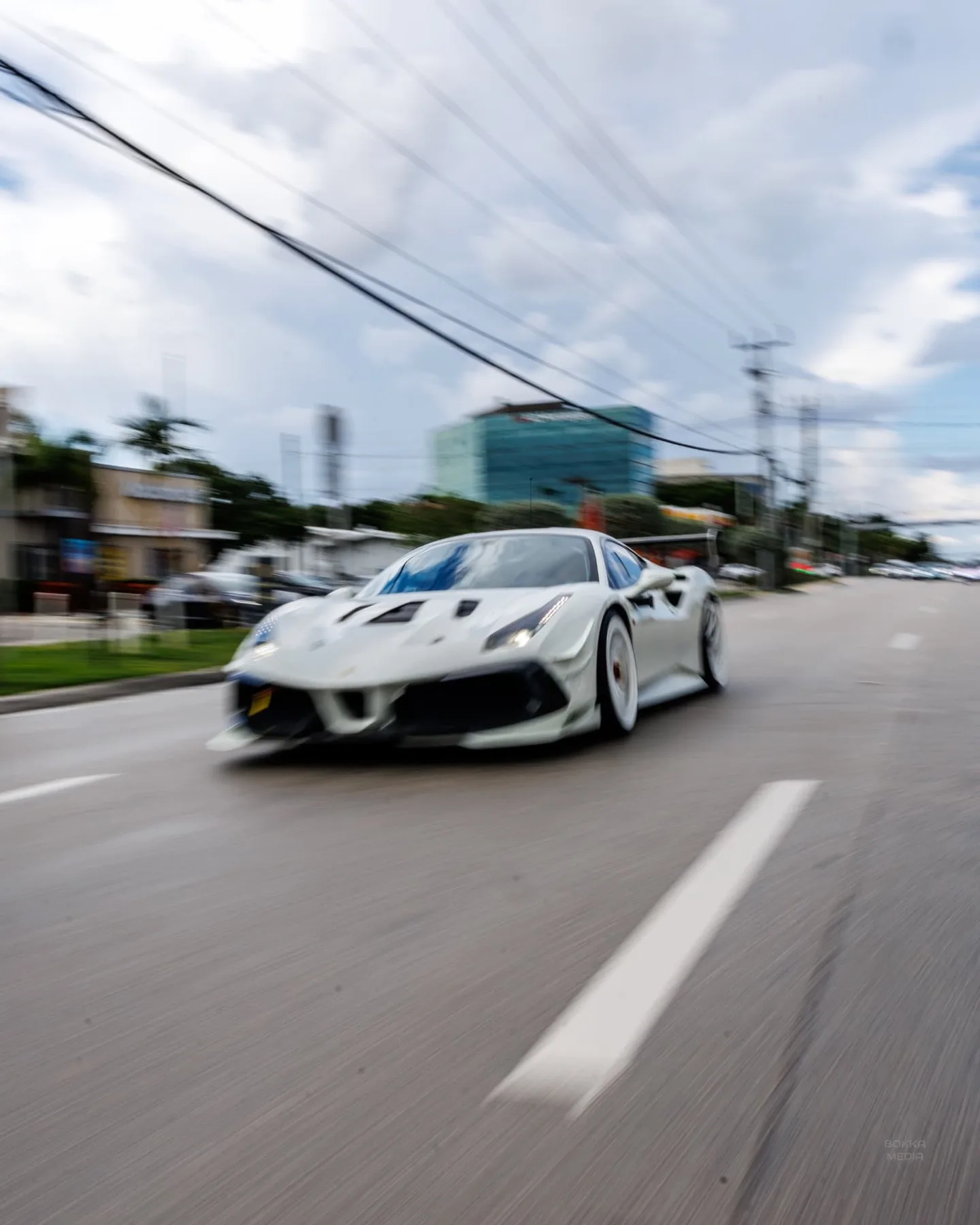White Ferrari 488 Pista in a front three-quarter rolling shot