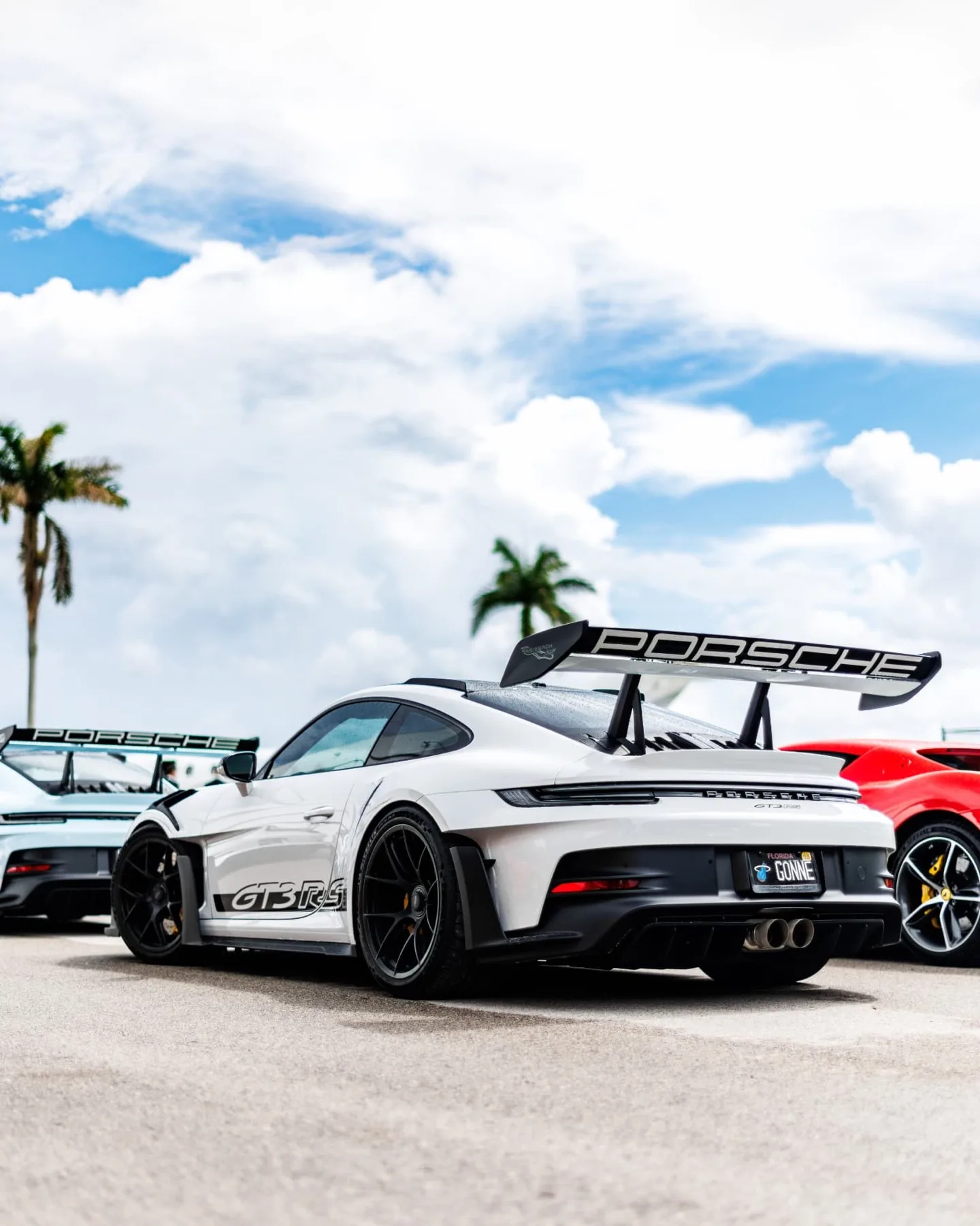 Rear view of a white Porsche 911 GT3 RS parked on the tarmac