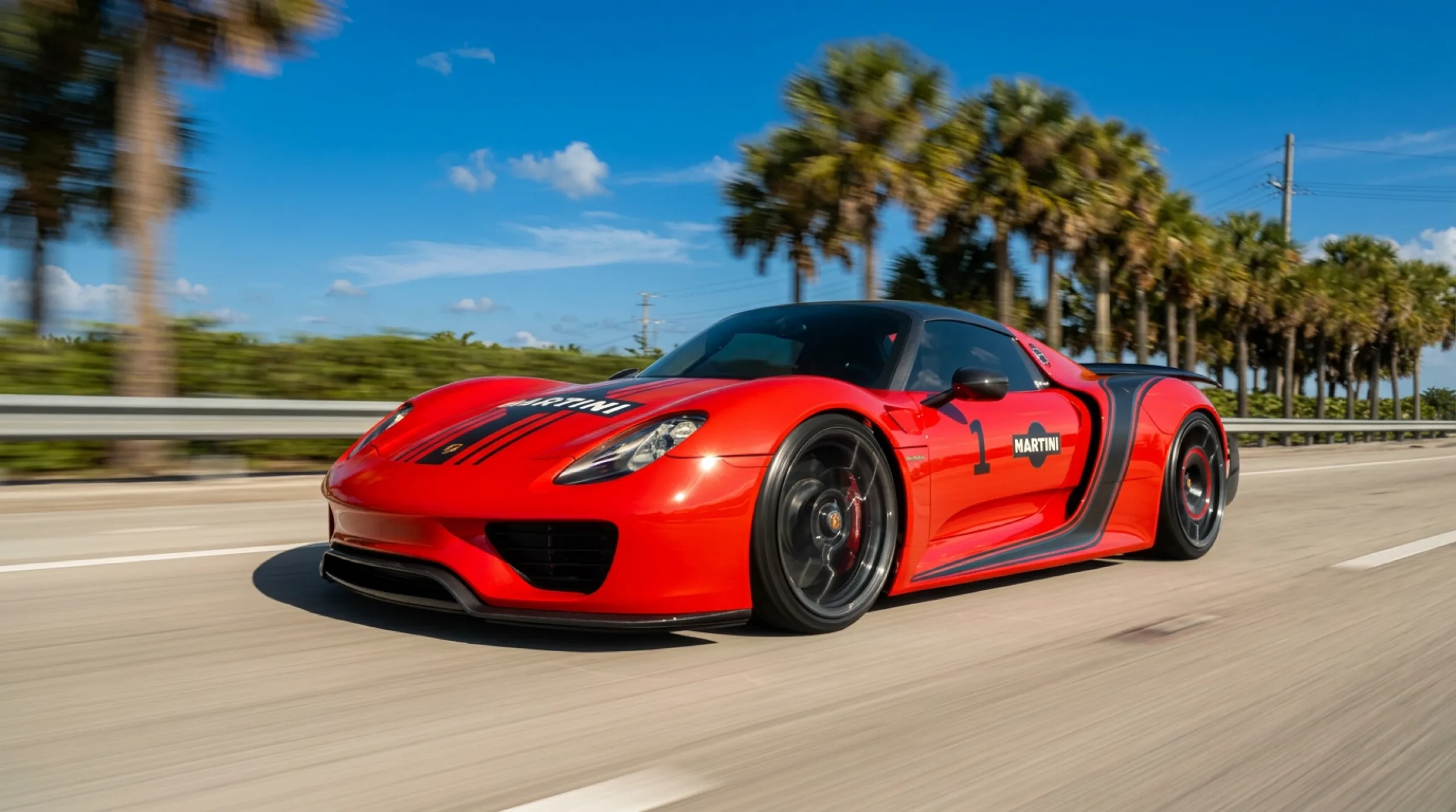 The Martini Porsche 918 rolling at speed inside the convoy